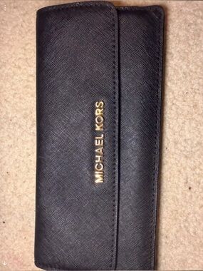 “Pre-Owned” Michael Kors Black Saffiano Wallet/Clutch With Gold Hardware.